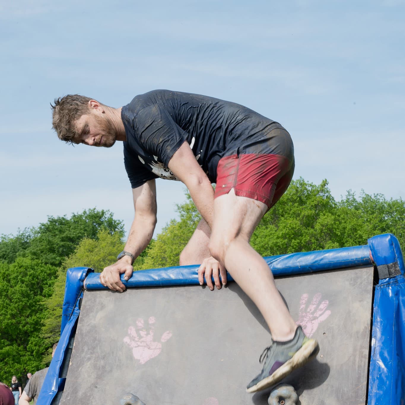 Pretty Muddy climbing obstacle photo.